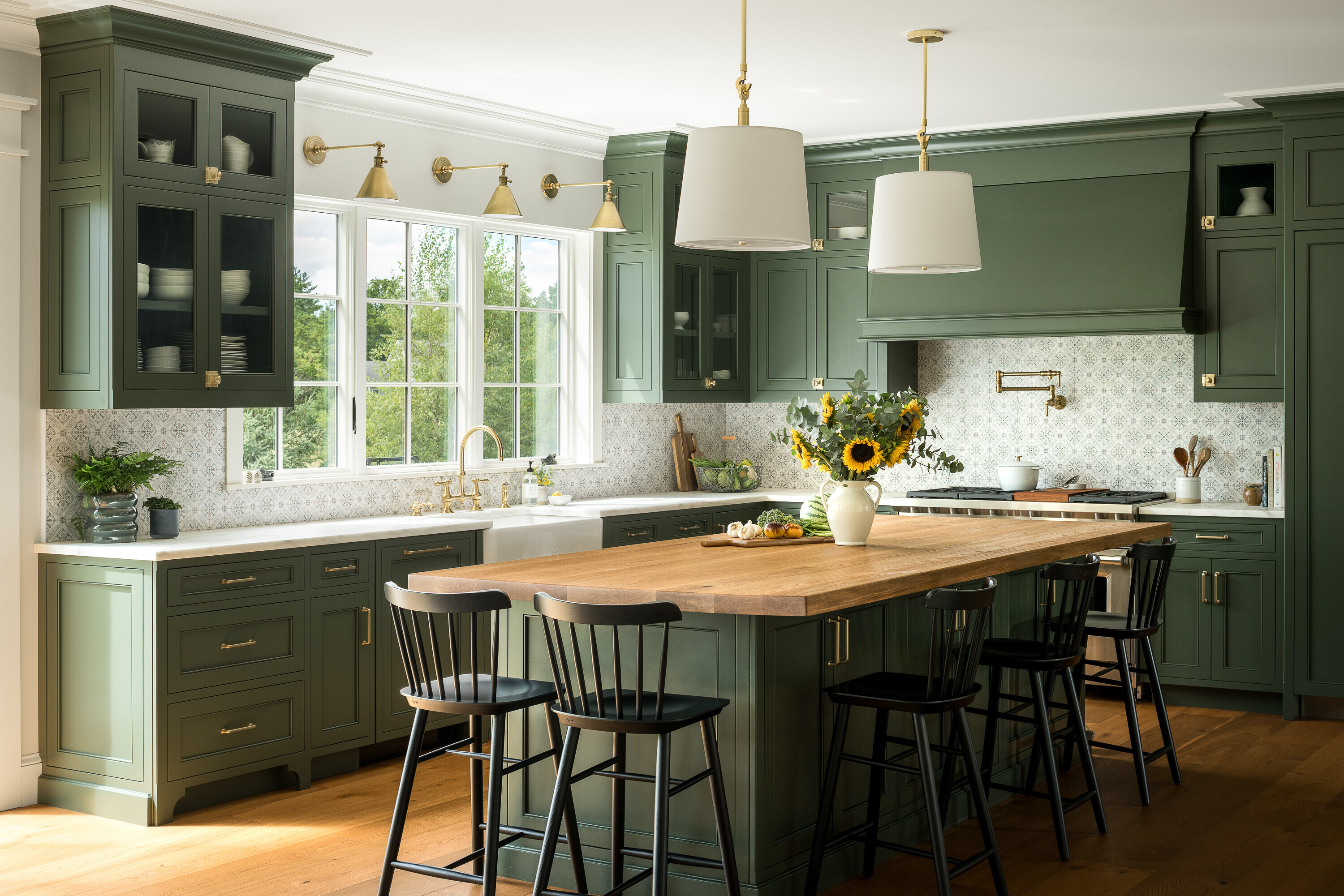 The newly renovated kitchen with custom green cabintery