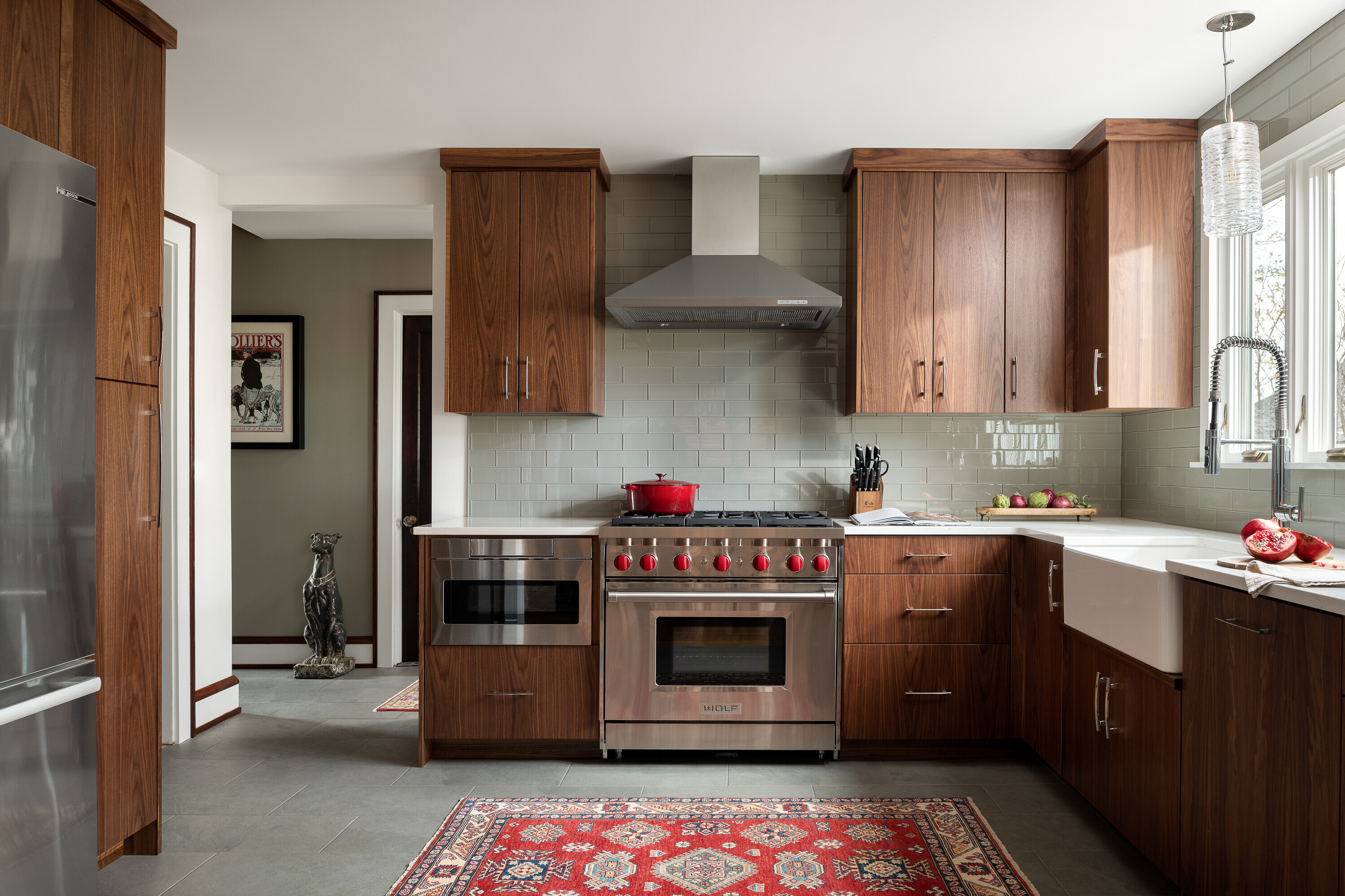This kitchen renovation features custom walnut cabinetry.